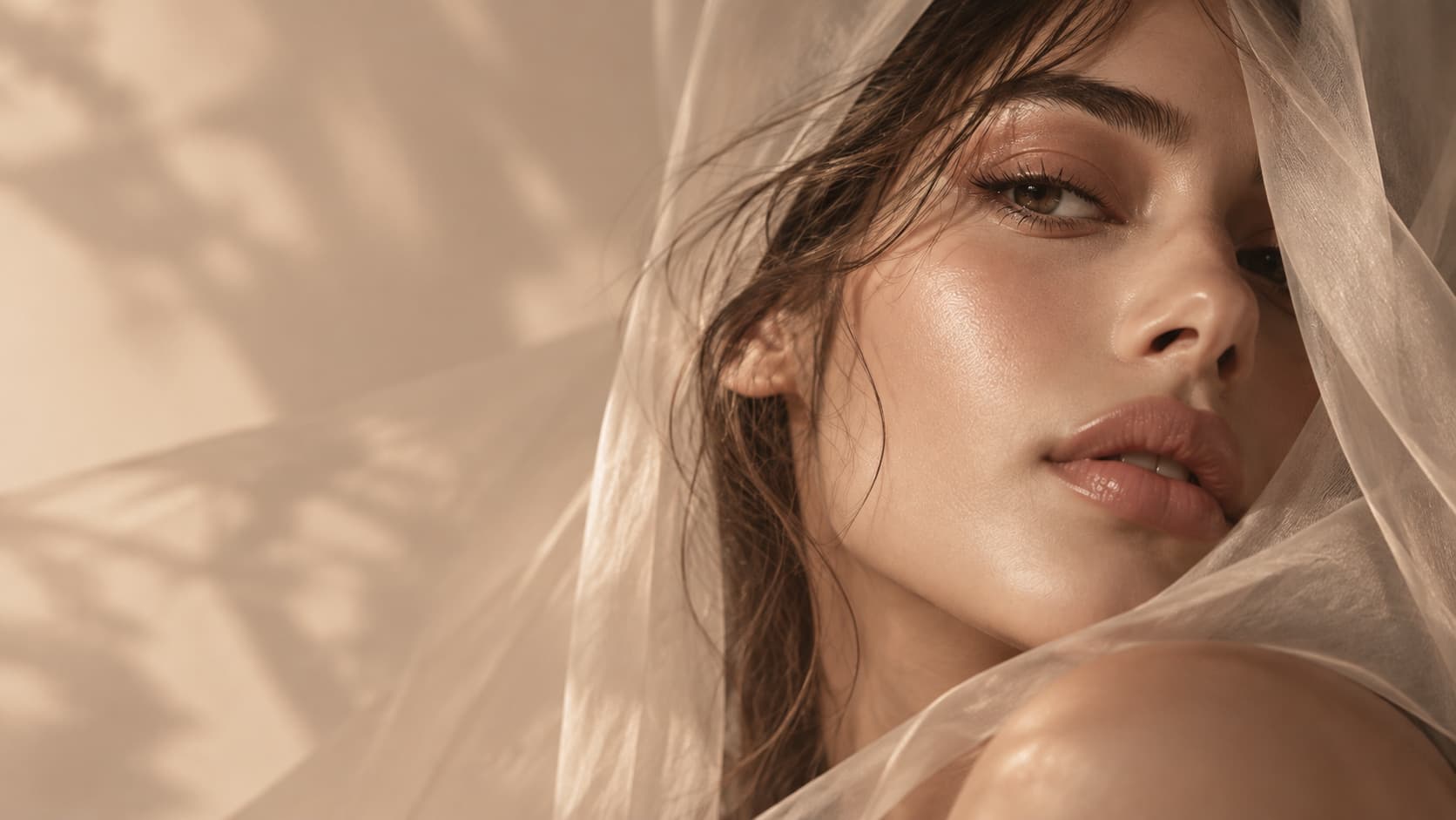 Close portrait with a satin nude lip and warm light